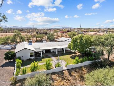 Single-story home with large backyard and mountain views at 56701 N Cope Rd, Wickenburg, AZ 85390