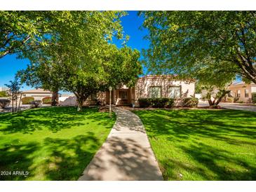 One-story house with a lush green lawn and a walkway at 2914 E Gary Way, Phoenix, AZ 85042