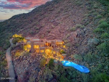 Stunning home nestled in the mountains with a large pool at 5802 E Cholla Ln, Paradise Valley, AZ 85253