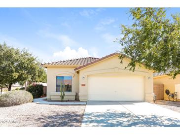 Single-story home with attached garage and desert landscaping at 34831 N Mashona Trl, San Tan Valley, AZ 85143