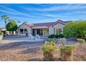 Spacious backyard with patio and desert landscaping at 16238 W Starry Sky Dr, Surprise, AZ 85374