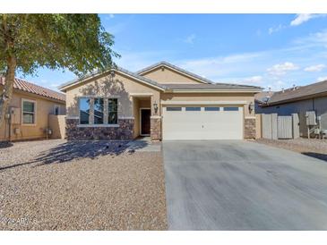 Single-story home with a two-car garage and desert landscaping at 736 E Gold Dust Way, San Tan Valley, AZ 85143