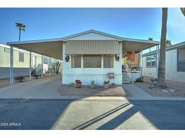 Charming single-wide home with carport and landscaping at 9333 E University Dr # 177, Mesa, AZ 85207