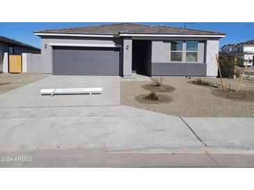 One story home with gray exterior and two car garage at 24078 W Pecan Rd, Buckeye, AZ 85326