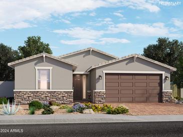 New construction home with a two-car garage and desert landscaping at 4346 W Josephine St, San Tan Valley, AZ 85144