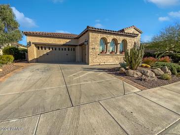 Two-story home with a two-car garage and nicely landscaped front yard at 12446 W Bajada Rd, Peoria, AZ 85383