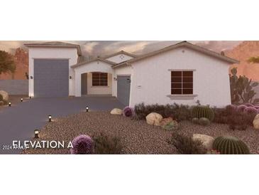 Single-story home with desert landscaping and two-car garage at 18743 N Avelino Dr, Maricopa, AZ 85138