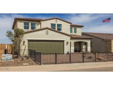 Two-story house with a two-car garage and a fenced yard at 12712 W Corona Ave, Avondale, AZ 85392