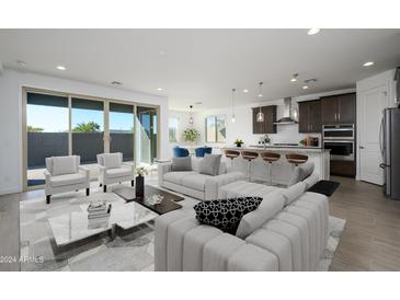 Open concept living and kitchen area with modern design at 735 E Marblewood Way, Phoenix, AZ 85048
