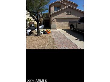 Two-story house with a two-car garage and landscaped front yard at 25409 N 40Th N Ln # 0, Phoenix, AZ 85083