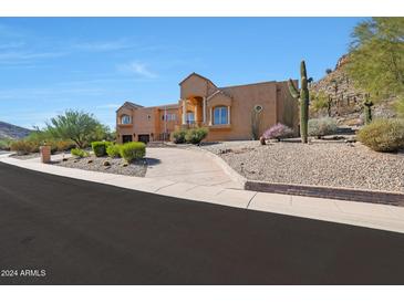 Stunning two-story home with desert landscaping and mountain views at 1044 W Indian Hills Pl, Phoenix, AZ 85023
