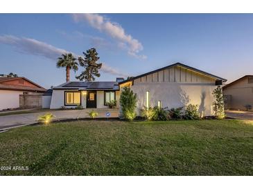 Updated single-level home with solar panels, landscaping, and a spacious yard at 3743 W Dailey St, Phoenix, AZ 85053