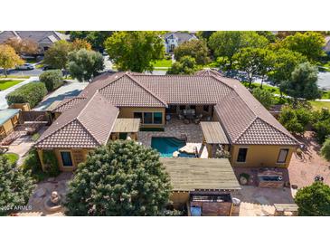 Luxury home with pool and expansive backyard, offering plenty of outdoor space at 2912 E Vaughn Ave, Gilbert, AZ 85234