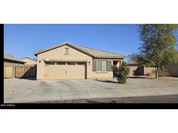 One-story house with a two-car garage and desert landscaping at 25422 W Maldonado Ct, Buckeye, AZ 85326