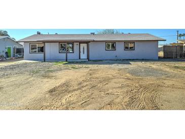 Newly renovated single story home with a large front yard at 17842 N 43Rd St, Phoenix, AZ 85032