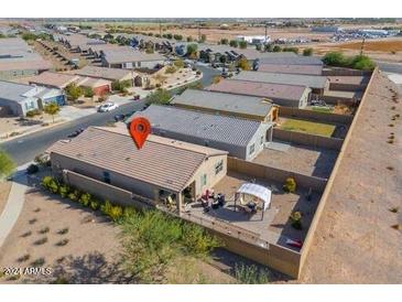 Aerial view of a single-story home with a backyard patio and covered seating area at 19782 N Lauren Rd, Maricopa, AZ 85138