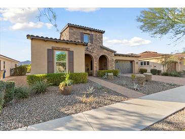 Beautiful two-story home with stone accents and landscaped yard at 4934 N 210Th Ave, Buckeye, AZ 85396