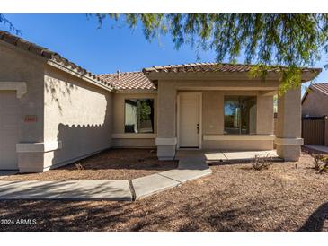 House exterior with covered porch and walkway at 15607 N 168Th Ave, Surprise, AZ 85374