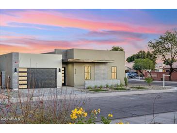 Stunning curb appeal with a modern facade and nicely manicured landscaping at 3125 N 86Th Pl, Scottsdale, AZ 85251