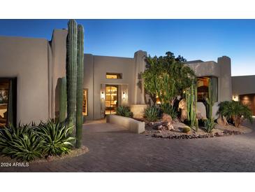 Stunning Southwestern-style home with a landscaped front yard and desert plants at 10040 E Happy Valley Rd # 504, Scottsdale, AZ 85255