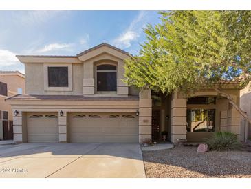 Two-story house with three-car garage and landscaping at 25714 N 70Th Ln, Peoria, AZ 85383