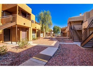 Apartment complex with walkway and landscaping at 11640 N 51St Ave # 250, Glendale, AZ 85304