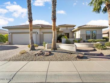 Beautiful desert home with three-car garage and attractive landscaping at 16907 W Greenbriar Point Ct, Surprise, AZ 85387