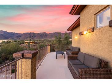 Spacious deck with wicker furniture and mountain views at 2724 S Falling Star Rd, Gold Canyon, AZ 85118