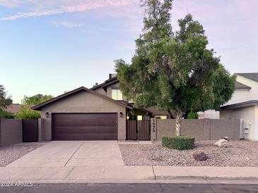 House exterior with a two-car garage and mature tree at 1520 W Jacinto Ave, Mesa, AZ 85202