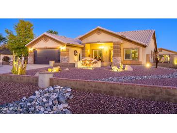 Stunning ranch-style home with a landscaped front yard and attractive exterior finishes at 5701 N 105Th Ln, Glendale, AZ 85307