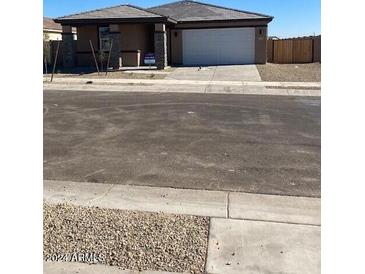 Single-story home with attached garage and desert landscaping at 3449 S 177Th Ave, Goodyear, AZ 85338