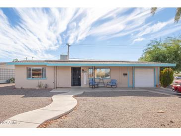 Charming ranch-style home with a well-maintained yard and walkway at 5627 E Covina Rd, Mesa, AZ 85205