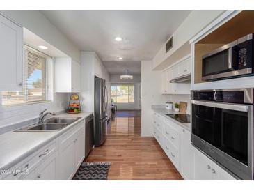 Bright eat-in kitchen, featuring stainless steel appliances and ample cabinetry at 10652 W Saratoga Cir, Sun City, AZ 85351