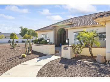 One-story home with desert landscaping and a brick entryway at 3853 E June Cir, Mesa, AZ 85205