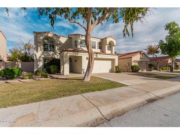 Two-story home with attached garage and well-manicured lawn at 4110 E Mercer Ln, Phoenix, AZ 85028