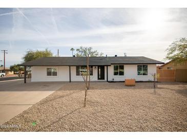 Newly renovated single story home with modern exterior and landscaping at 1501 W Grovers Ave, Phoenix, AZ 85023