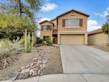 Two-story house with landscaped front yard and a two-car garage at 40972 W Hayden Dr, Maricopa, AZ 85138