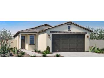 One-story house with a two-car garage and desert landscaping at 14586 W Wood Dr, Surprise, AZ 85379