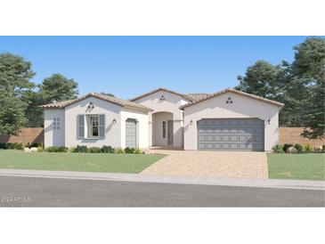 Single-story home with two-car garage and landscaped front yard at 25169 N 177Th Dr, Surprise, AZ 85387