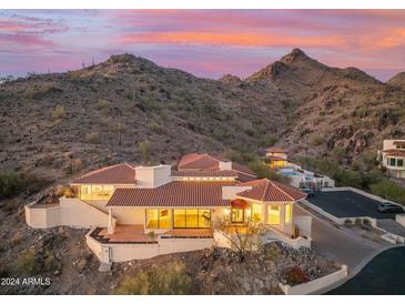 Luxury home nestled in the mountains at sunset at 3800 E Lincoln Dr # 55, Phoenix, AZ 85018