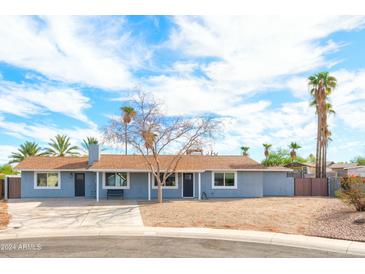 Updated single-level home with a large front yard and mature trees at 15839 N 19Th St, Phoenix, AZ 85022