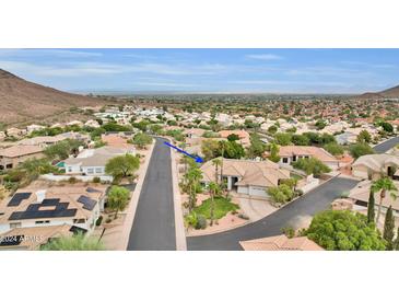 Aerial view of a house and surrounding neighborhood, showcasing the property's location and community at 1604 E Sheena Dr, Phoenix, AZ 85022