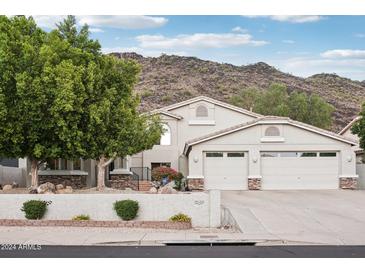 Two-story home with attached two-car garage and mountain views at 21229 N 52Nd Ave, Glendale, AZ 85308