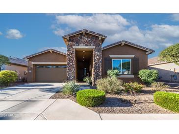 Single story home with stone accents and a two-car garage at 2466 N 212Th Ln, Buckeye, AZ 85396