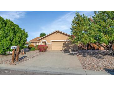 Single-story house with a two-car garage and landscaped front yard at 4736 W Marconi Ave, Glendale, AZ 85306