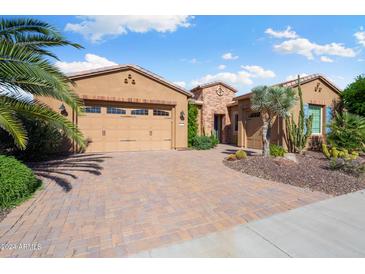 Beautiful home with desert landscaping and a three-car garage at 29127 N 129Th Ave, Peoria, AZ 85383