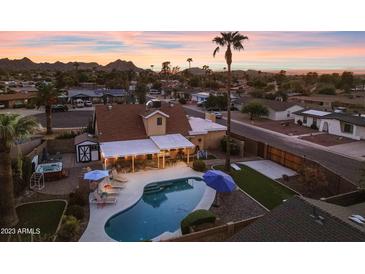 Aerial view of a house with a pool, spa, and backyard entertainment area at 2929 E Bloomfield Rd, Phoenix, AZ 85032