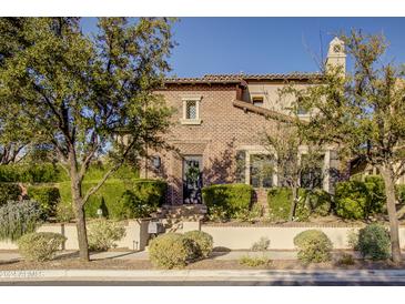 Brick home with landscaping and a welcoming front entrance at 10191 E Diamond Rim Dr # 2122, Scottsdale, AZ 85255