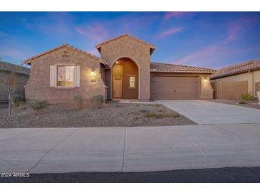 Beautiful one-story home with a tile roof, and landscaped front yard at 18322 W Long Lake Rd, Goodyear, AZ 85338