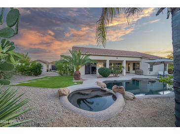 Inviting pool and spa with a relaxing patio area at 730 E Mesquite St, Phoenix, AZ 85086